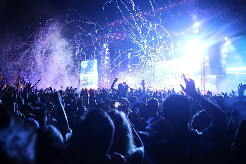 Concertgoers at last year's Coachella Valley Music and Arts Festival revel in the pulsating music and light show. This year's event is expected to attract nearly 100,000 people per day to the festival, which spans two weekends in April.