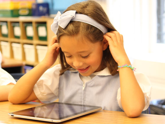 Student at the Marymont School of New York uses school-issued iPad