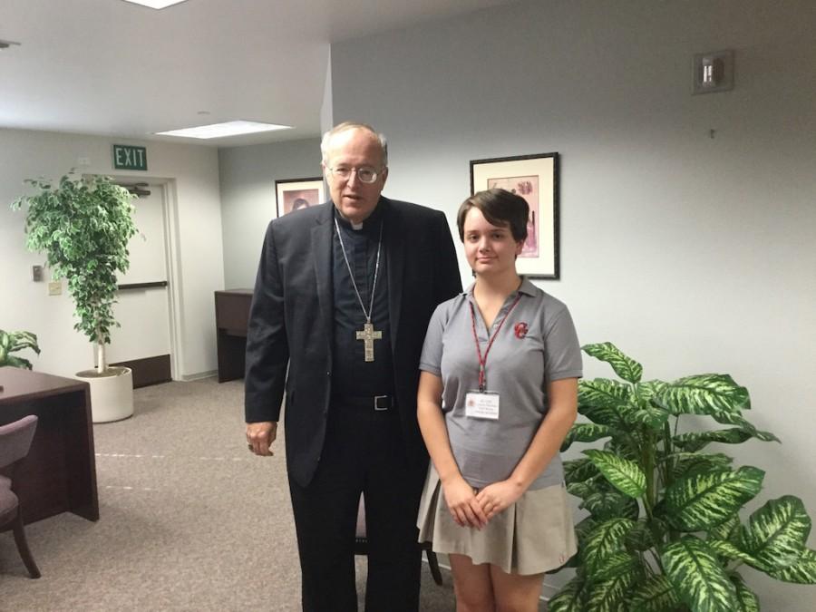 After an interview  at USD regarding a variety of topics, El Cid staff writer Lauryn Sanchez poses for a picture with Bishop Robert McElroy .