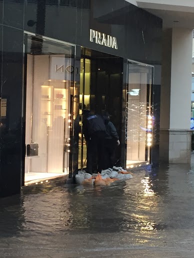 Sandbags hold back water from flooding Prada, an upscale Italian clothing and accessory store located on the bottom floor at Fashion Valley Mall, during the recent storms that swept through San Diego County. San Diegans can expect more of the same inclement weather in the coming weeks due to El Niño.