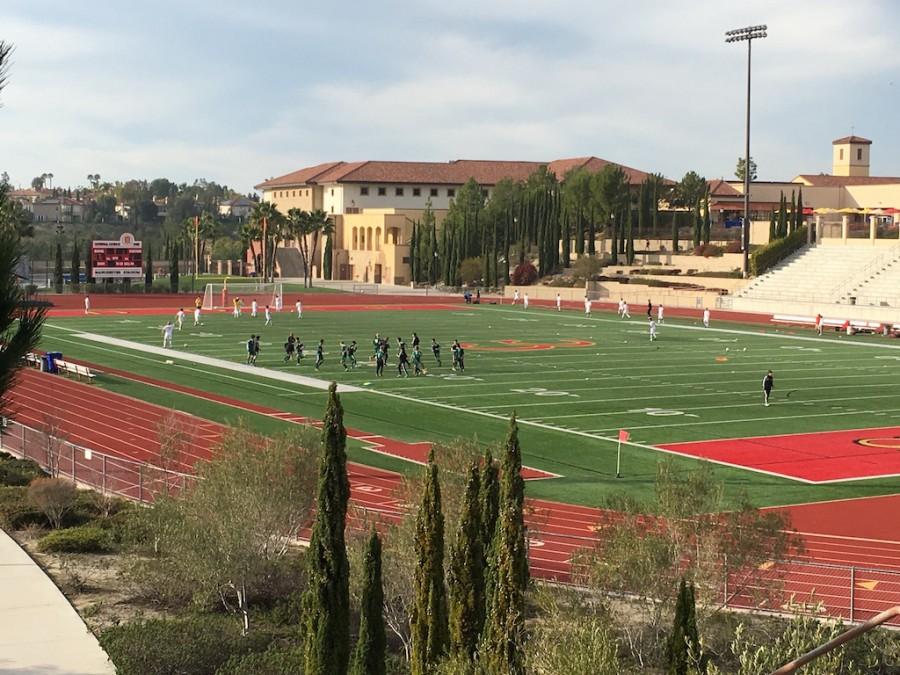 The CCHS varsity boys soccer team warms up for their game against Coronado High School. 