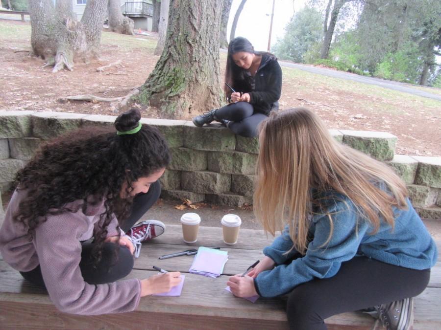 Students Niki Maroon ‘16, Katrina Acebedo ‘16 and Abby Schlehuber ’16 write affirmations to other students while on senior retreat near Palomar Mountain. Affirmations are an opportunity to spread compliments, prayers and well wishes to people that make an impact on students’ lives.