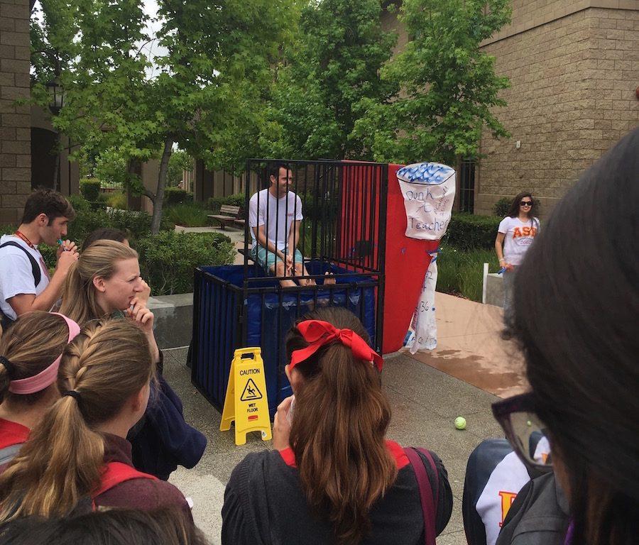 Mr. Brett Ormbsy prepares himself to be dunked in the dunk tank by at the annual Spring Carnival.
