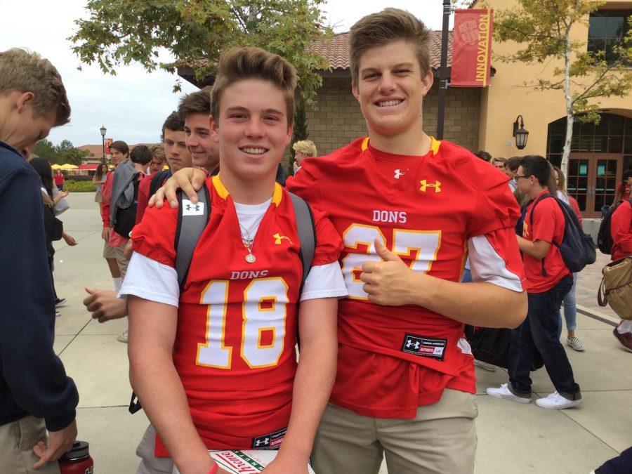 Juniors Thomas Kane-Berman and Jake Lynch show their school spirit by wearing their football jerseys on the day of the first varsity football game. 