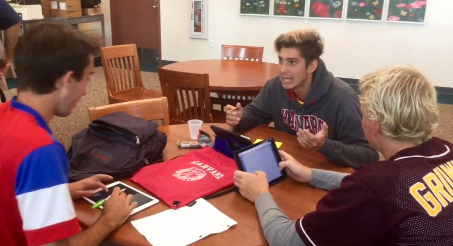 Stress gets the best of Dennis Blyashov ‘17 as he works in the library. While under pressure students often feel irritability or anger due to lack of sleep.