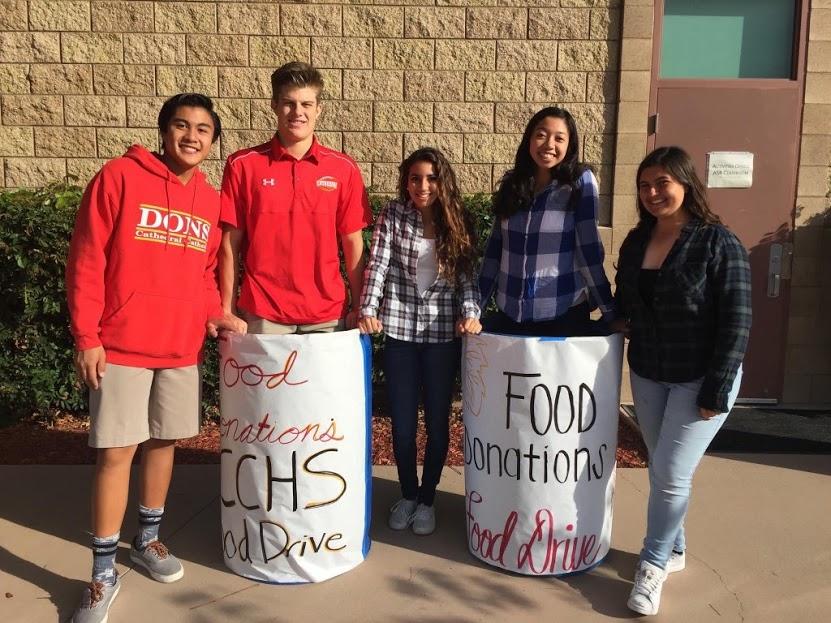 ASB members Kris Pua 18, Jake Lynch 18, Daniella Brunetto 18, Mia Bautista 18, and Nicole Barno 18 give themselves to the cause of the fall food drive.
