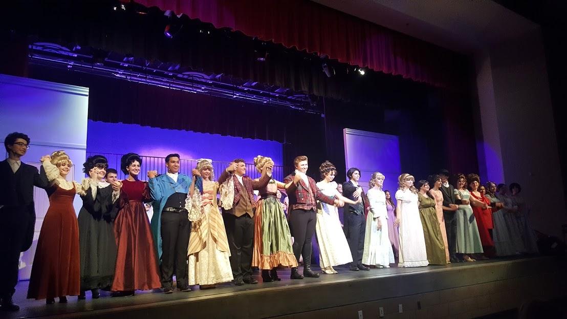 The cast and crew of the Cathedral Catholic High School fall play, Pride and Prejudice, bow at the end of their first performance last Friday.