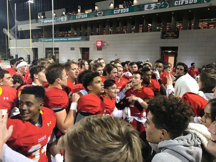 The CCHS varsity football team prepares to deliver a post-game, celebratory chant to the audience after defeating Helix High School 35-27 in the CIF Open Division Championship.
