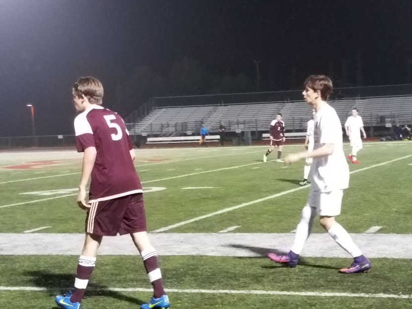 CCHS boys varsity soccer player Jeroni Bertran 17 (right) awaits an incoming pass from a teammate, keeping his distance from the Bishops School defender.