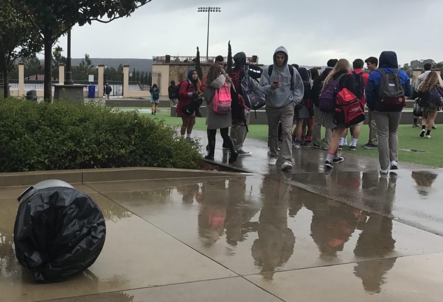 By ignoring the trash blown over by the rain storm, students contribute to the ongoing campus waste issue. 