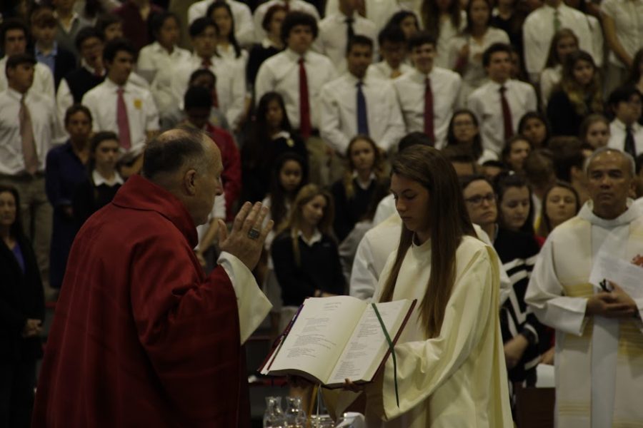 Bishop Robert McElroy celebrates the liturgy of St. Polycarp with the help of CCHS altar server Anna Bourke ‘18, immersing himself into the community as one of schools own members.
