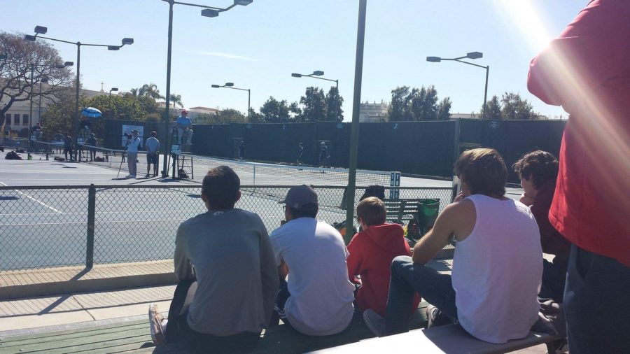 Looking for a competitive advantage to use in their next match, CCHS varsity tennis players watch a match between the University of San Diego and the University of California, Irvine. The Toreros defeated the Anteaters in the match at USD.