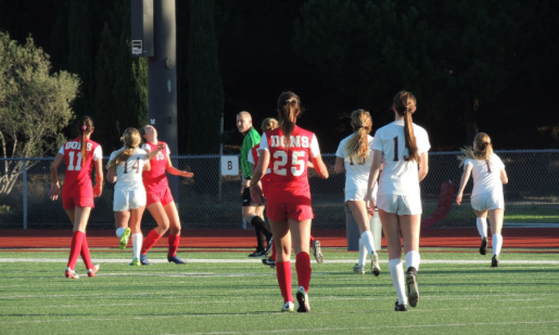 CCHS student-athlete and future Stanford University Cardinal Bianca Ferrara  18, who wears number 11, prepares to receive the ball in a match earlier this season versus Point Loma High School. Ferrara recently signed with Stanford even though she is still a junior. 