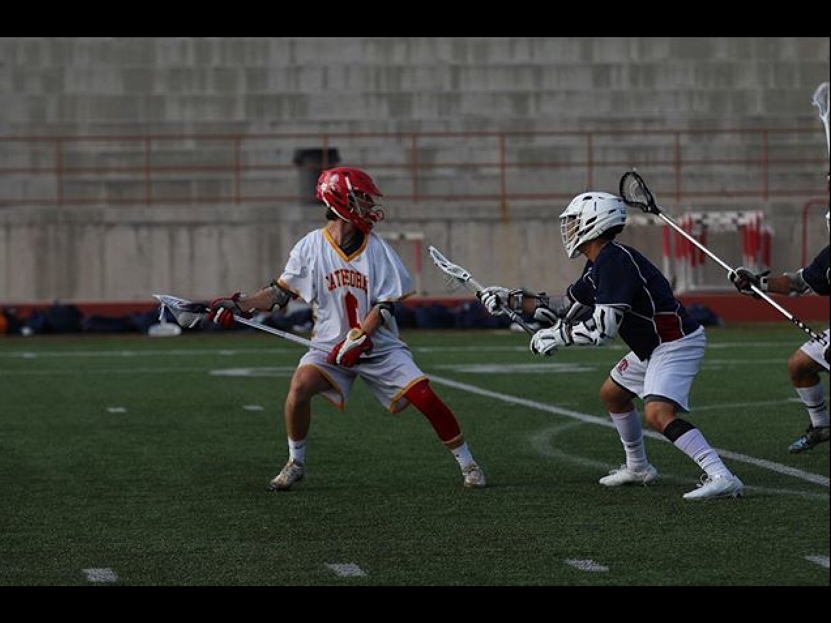 CCHS+lacrosse+player+Connor+Mataczynsky+%E2%80%9818+dodges+an+opposing+player+attempt+to+give+the+Dons+a+lead+in+its+close+game+against+the+Vikings.