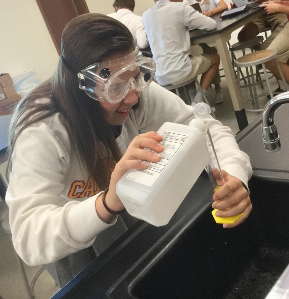 Kylie Knepler 20 painstakingly pours alcohol into a graduated cylinder during an experiment in Mrs. Kay Dunns chemistry class. The students are working on measuring the density of liquids. 
