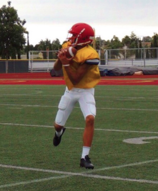 Backup quarterback Caleb Price 19 catches a pass in preparation for the Dons season finale against Saint Augustine at Manchester Stadium. 