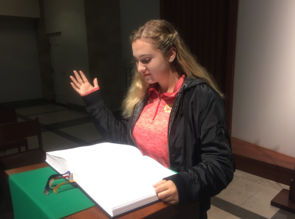 Ava Montali 19 reads the first reading at Friday morning mass in the chapel, one of her main jobs as a CCHS campus minister. 
