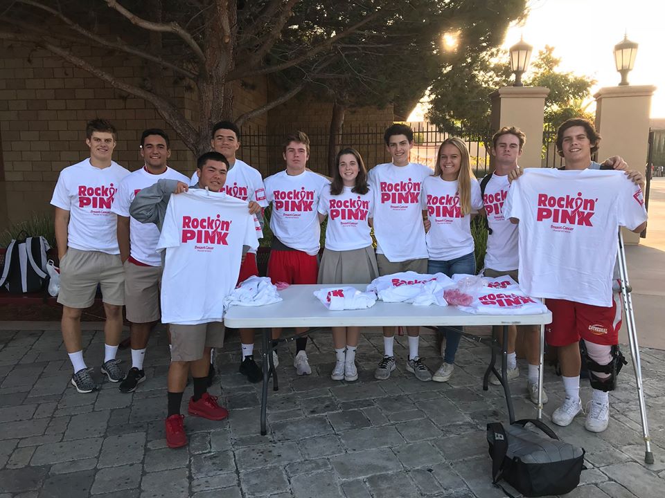 Brycen Newman '18 sports one of his T-shirts among friends, spreading awareness of breast cancer, which displays their commitment to help people who are in treatment.