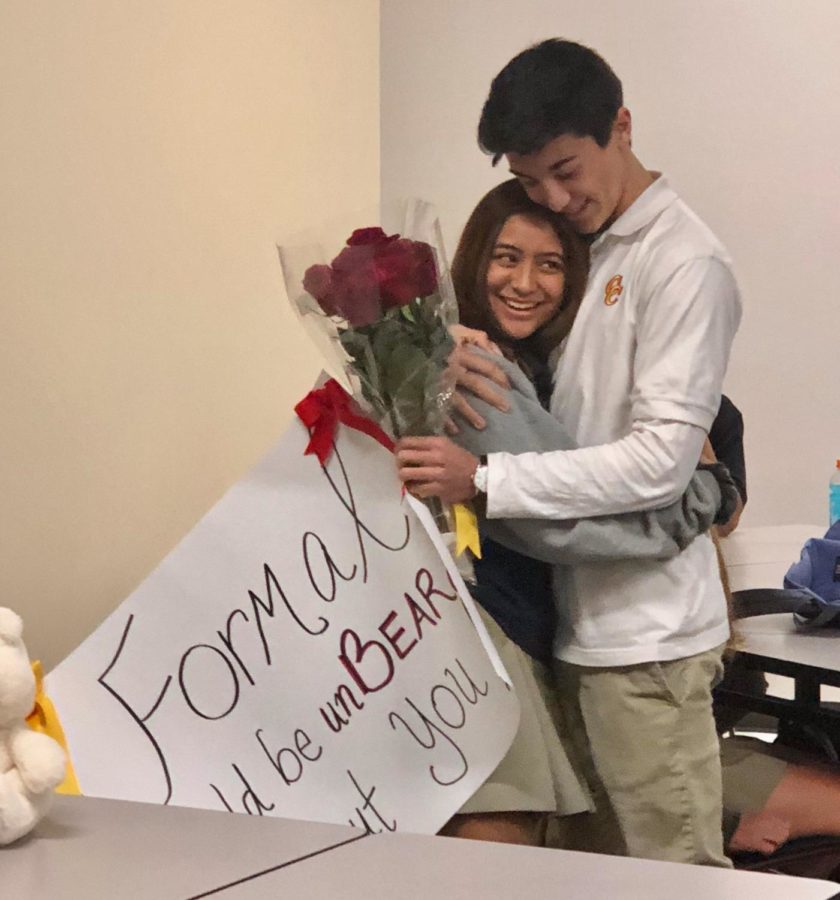 Vincent Willyard 20 asks Lisette Gomez-Galvan 20 to formal Monday during Ms. Jenelle Roberges English 2 Honors class, complete with a bouquet of red roses, a teddy bear, and a poster sporting the phrase Formal would be unBEARable without you. 