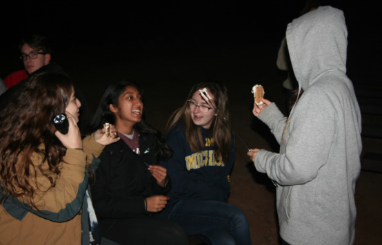 Nicole Kharat ‘19, Calista Oliveira ‘19, Kenna Soares ‘19, and Josephine Nguyen ‘19 roast s’mores on Wednesday at Whispering Winds Catholic Camp and Conference Center in Julian, California.
