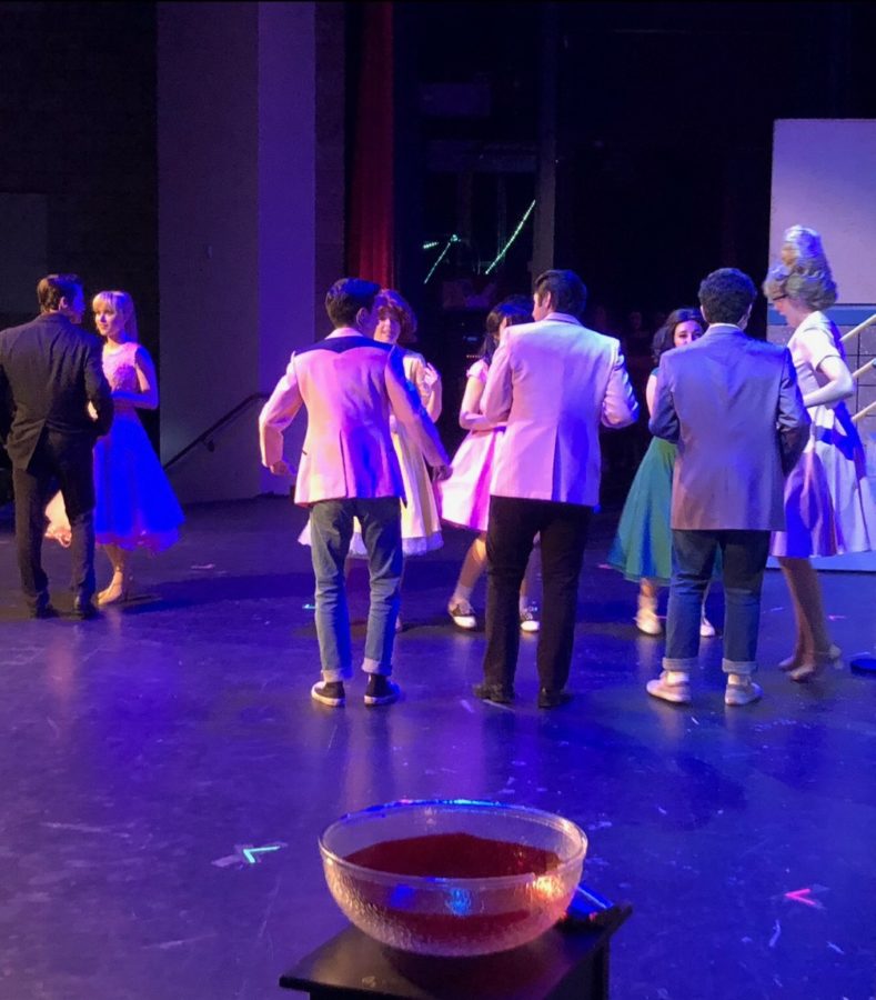 Cast members of the CCHS production of Grease perform the Prom Night scene at the showing of Grease on Saturday night. CCHS drama teacher Mrs. Katie Wilson directed Grease, which enjoyed a three-day run, with all four shows sold out.  