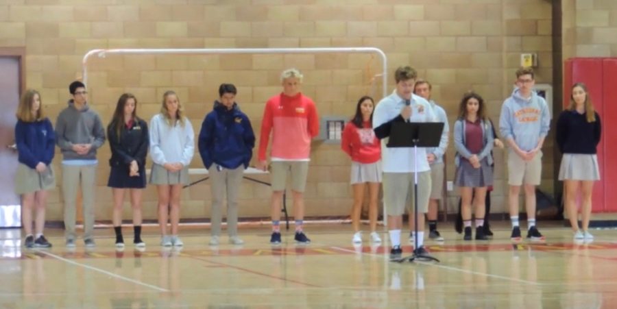 The United Student Leadership Council leads an all-school prayer service Wednesday in the Claver Center to honor the 17 lives lost during the recent shooting in Parkland, Florida, offering up prayers for the victims and families from Marjory Stoneman Douglas High School. 
