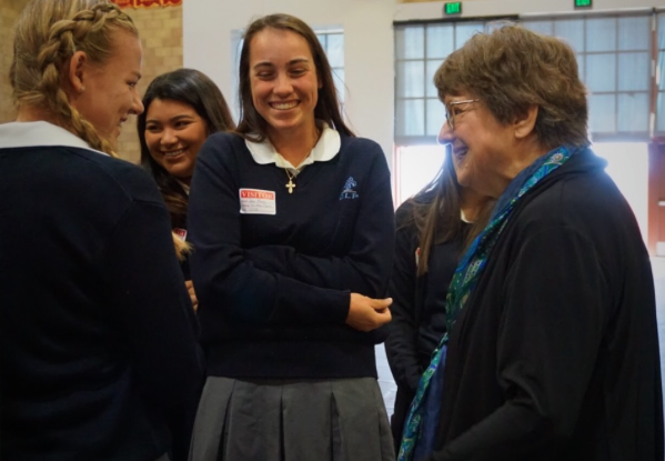 Death penalty activist and best-selling author Sister Helen Prejean (right) talks to visiting students from the Academy of Our Lady of Peace last Wednesday after her speech at Cathedral Catholic’s Claver Center.  

