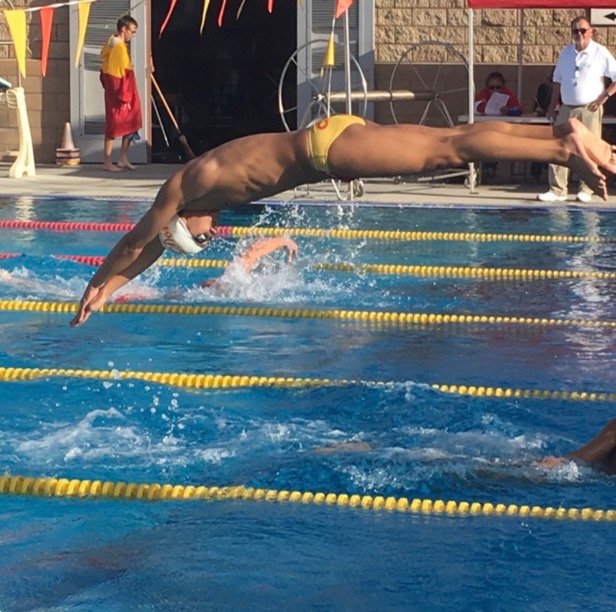 Yuma Dugas 20 dives into his race during the CCHS meet against Coronado High School on Friday. 