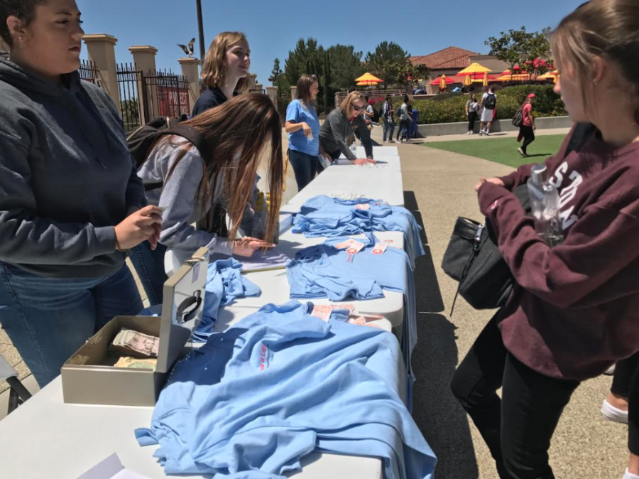 CCHS NHS embers sell Save a Life t-shirts designed by Rachel Brenk 19 during lunch as a part of the CCHS Suicide Prevention Week, which aimed to shed light on mental health issues and what students can do to help peers affected by depression and suicide. 