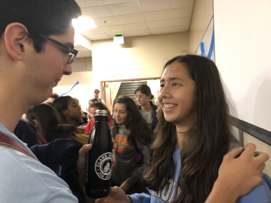 Diego Vildosola 18 and Karenna Wurl 19 anticipate Mr. Francis Caros entrance to his surprise party during lunch Friday, an event organized by NHS members and psychology students, intending to thank Mr. Caro for all he has done for his students. 