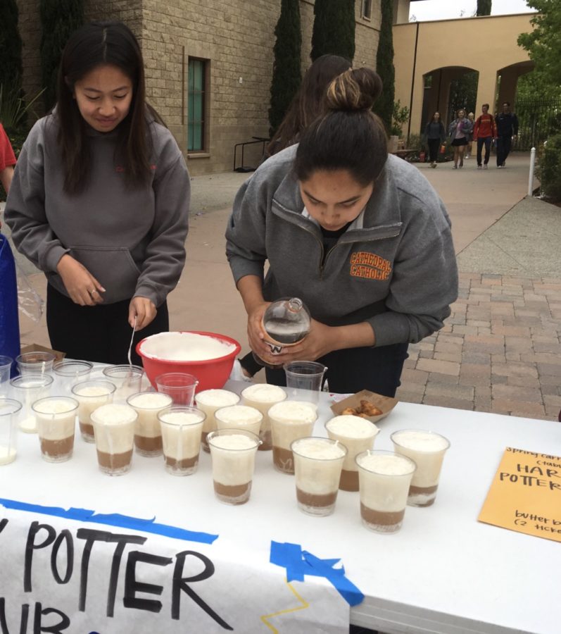 Harry Potter Club members Julianna Inigo 19 and Rachel Carrillo 19 make butter beer for the ASB Spring Carnival during lunch Friday.