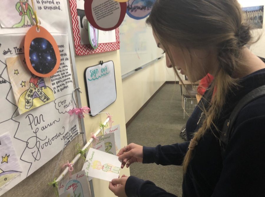 Riley Staal 19 takes a gander at The Little Prince projects that Mrs. April Kurtzhalls French 3 class completed after reading The Little Prince, a story about childhood and friendship. 