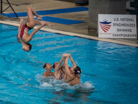 Alexandra Suarez ‘18 and her team, the Santa Clara Aquamaids, perform a lift at the 2018 U.S. Junior National Synchronized Swimming Championships in Lewisville, Texas, where the team won gold.
