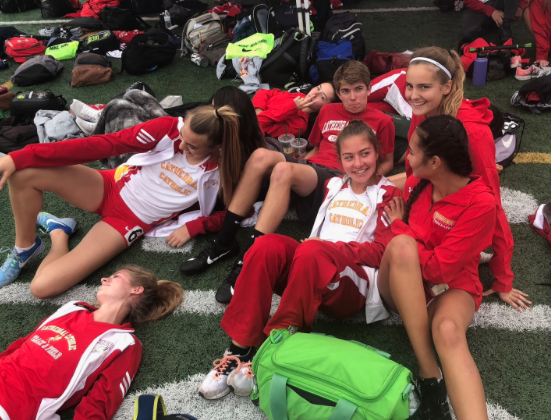 Cathedral Catholic High School track athletes take a break after a recent meet. They have each excelled in every event of the season, making their coach proud as the boys won CIF, and the girls finished just short. 
