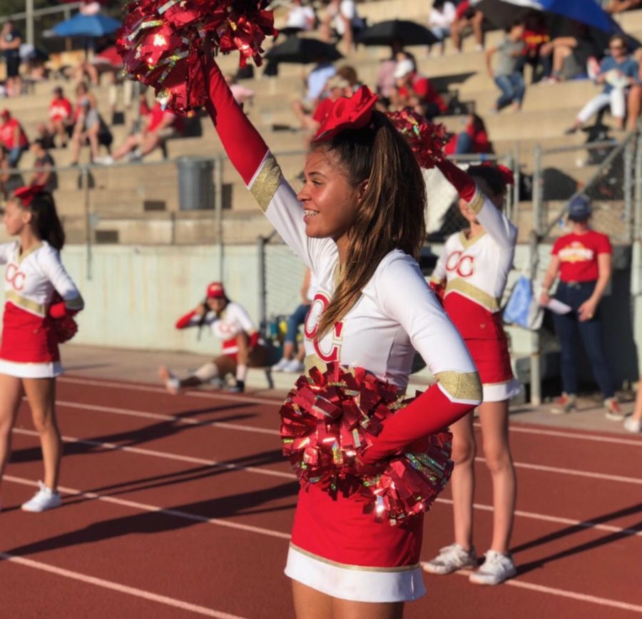 Olivia Worthen 22 cheers on the CCHS JV football team to their 56-0 win last Friday against Monte Vista High School.