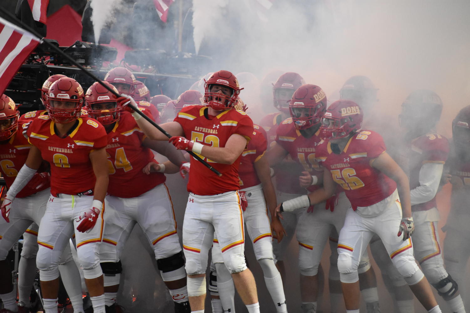 Miles McCormick ‘19 leads the Dons varsity football team through the tunnel and onto the field before the annual Honor Bowl game on Saturday night, where CCHS took down Serra Gardena High School 42-21 after a night full of football and a thankful celebration of American veterans.