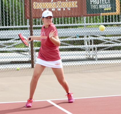 During a doubles match against Patrick Henry High School in 2016, Kate Harrington ‘19 prepares to return a shot from the opposing team. She and her partner won the match and their team later became victorious at the Western League Championships.
