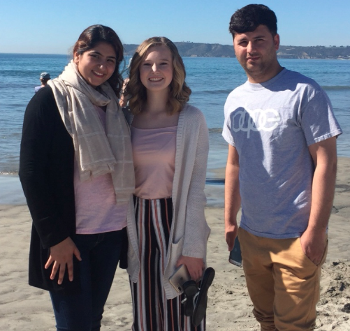 Molly Abrom ‘21 helps show a refugee couple from Afghanistan around San Diego by visiting Coronado beach. 

