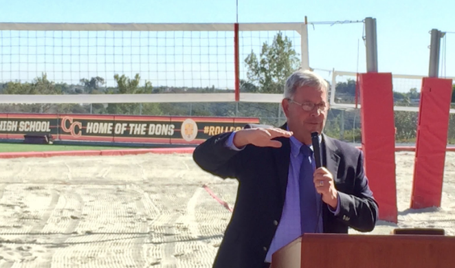 Cathedral Catholic High School President Steven Laaperi spoke to volleyball team members and other students Monday about thanking God for the wonderful new sand volleyball courts in preparation for the honorary court blessing ceremony.
