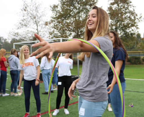 Jackie Schnell ‘21 reaches for the hold of another group member during a team bonding game at the girls sophomore retreat this past Thursday. The day was filled with games, talks, and small group time, all organized and led by senior Campus Ministers.