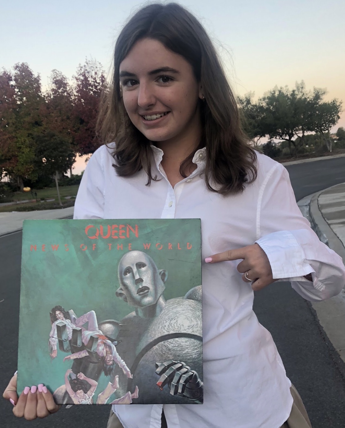 Cathedral Catholic High School student Megan Garvey ‘22 holds a Queen record as she prepares to view the upcoming film, Bohemian Rhapsody, which describes Mr. Freddie Mercury’s life and his journey while leading Queen on its path to fame.