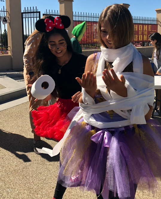 As a part of the Halloween-themed games hosted by ASB last Wednesday, Maia Kristensen ‘22 and Shianne Ermani ‘22 wrap each other in toilet paper.
