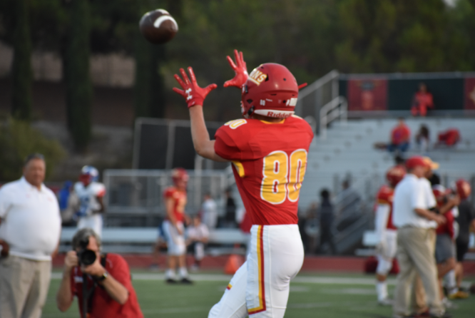 Wide receiver Trevor Wahl ‘20 warms up before his State Championship game on Friday. The Dons ended up with the victory 24-21, which advanced it to the State Championships. 
