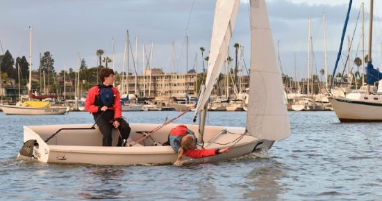 Kyle Gallagher ‘19 and Claire Backer ‘21 sail a downwind stint during a practice exhibition race in early December. 