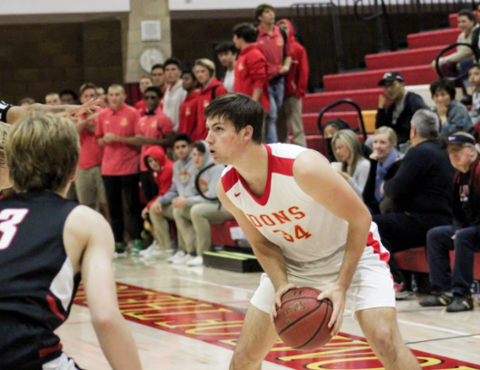 Thomas Notarrani 21 prepares to sink a three-point shot during the basketball game Dec. 4.