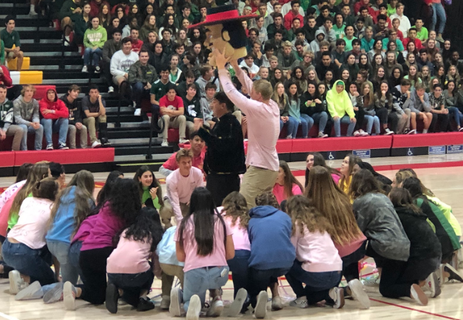 At the winter formal rally this week, Tommy Gruwell ‘19, leader of Los Locos and a varsity water polo player, leads ASB in a dance performance, ending with Gruwell pulling off the head on the Don Diego costume to reveal Father Martin Latiff, who proceeded to lead us in prayer.
