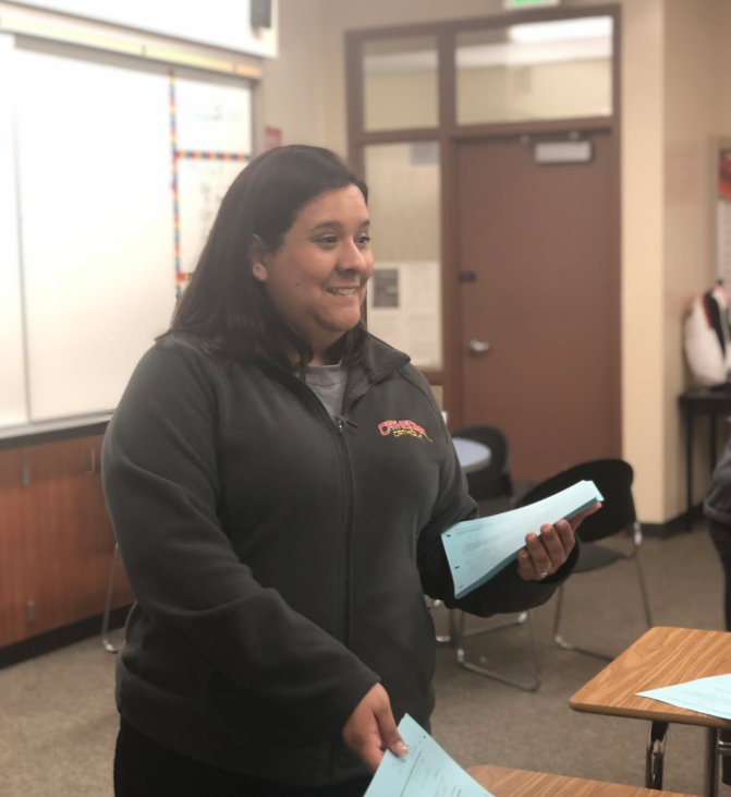 Mrs. Adrianne Warren, first year geometry teacher and algebra teacher at Cathedral Catholic High School, prepares her geometry classes for their upcoming test with a practice test and review packet. 
