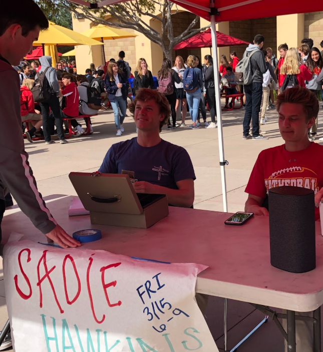Dylan Vorndran ‘19 and Jake Ratterman ‘19 sell tickets last week to students interested in attending Cathedral Catholic High School’s first Sadie Hawkins dance, which more than 70 people attended.
