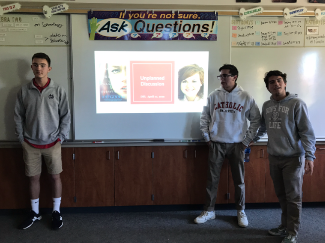 Presenting a PowerPoint, Cathedral Catholic High School Student Ben Nash ‘19 (left), a member of the Dons for Life Club, leads club members in a discussion about Unplanned, a movie that sheds light on the pro-life movement and abortion industry secrets. 
