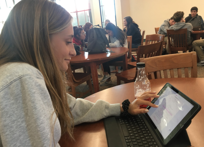 Grace Kotsay ‘22 looks over a review sheet for her Catholic Faith 9 class in preparation for the final, which will be during finals week, two weeks from now. Many Cathedral Catholic High School students will prepare for their finals in the coming days.
